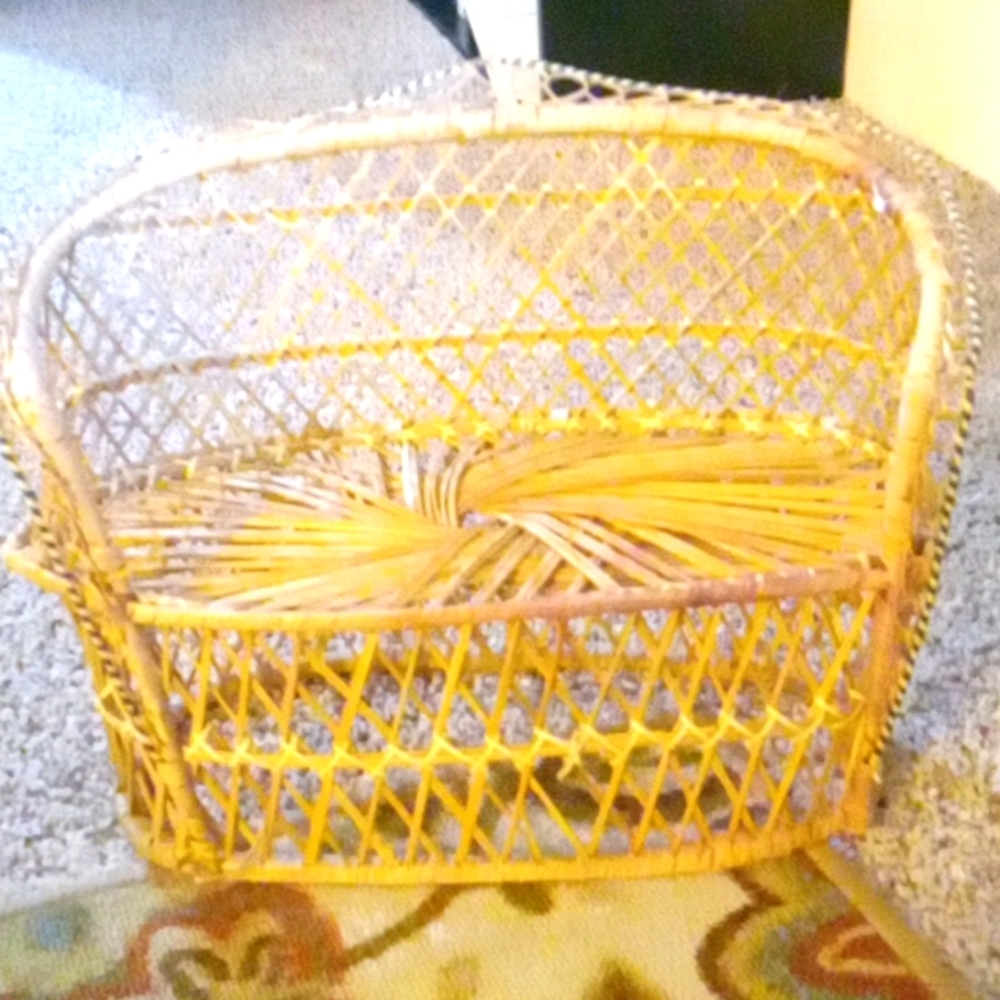 Vintage wicker peacock loveseat.
